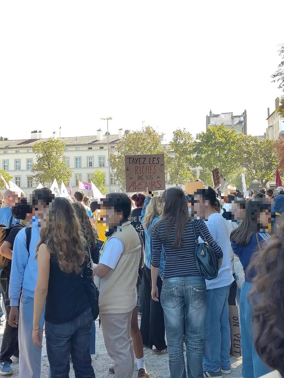 Protest sign reading “Taxez les riches, pas nos avenirs” at “High school student protest in Nancy — 6 October 2026” in Nancy, France.