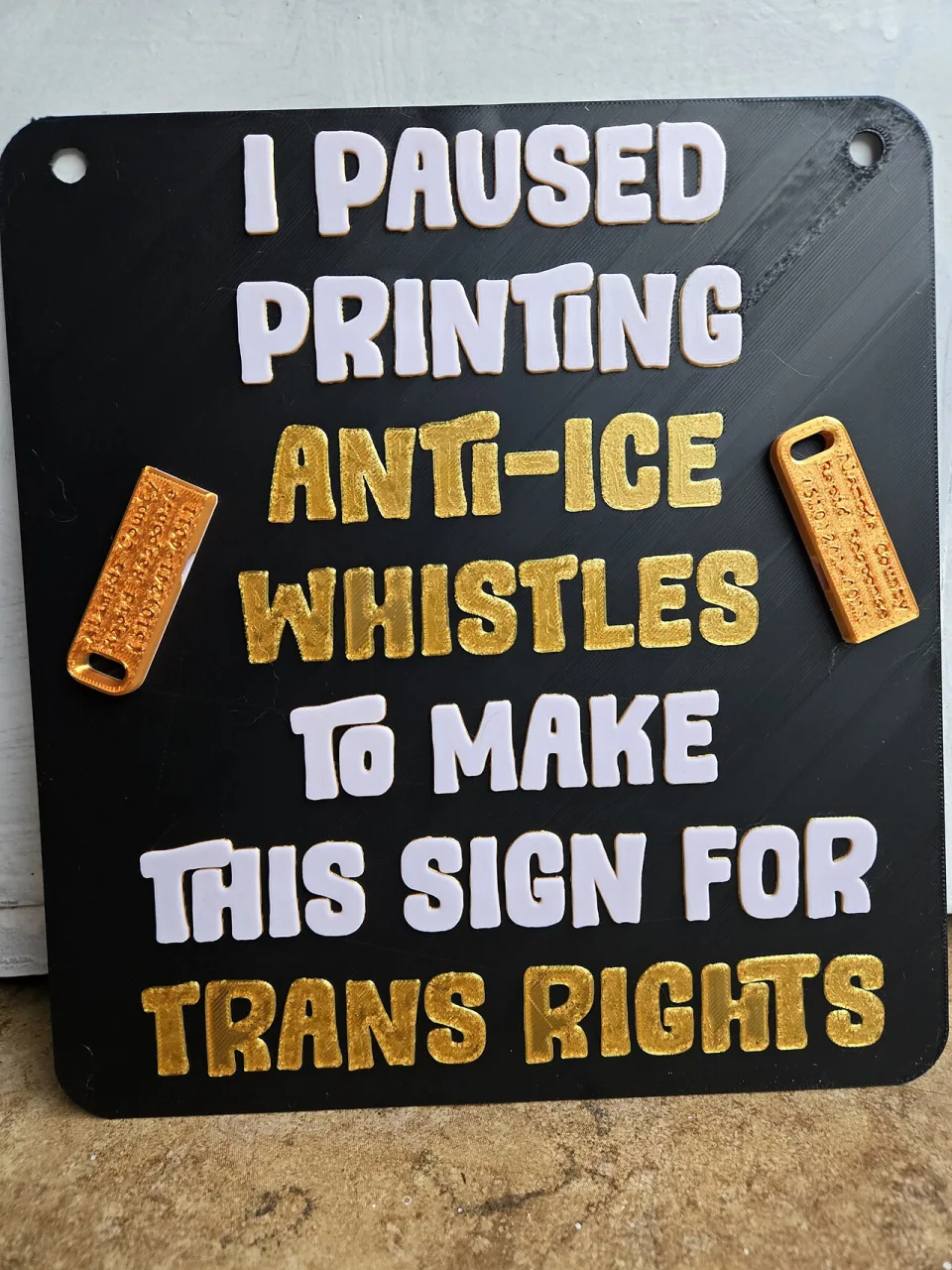 Protest sign reading “I paused printing anti-ICE whistles to make this sign for trans rights” at “No Kings in San Francisco — 28 March 2026” in San Francisco, United States.