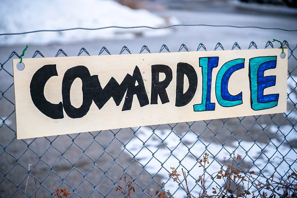 Protest sign reading “CowardICE”, photographed in Minneapolis, United States.