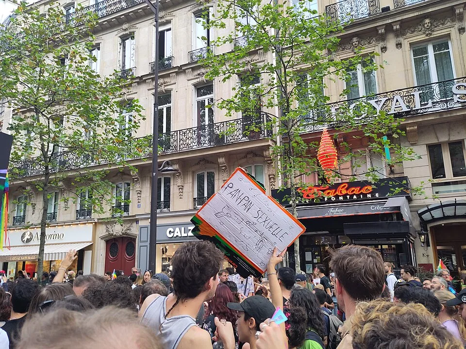 Protest sign reading “Panpan sexuel.le” at “Paris Pride — 3 October 2026” in Paris, France.