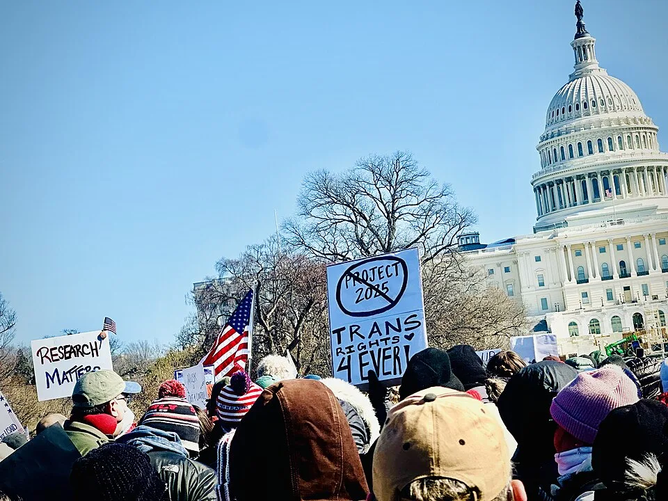 Protest sign reading “Trans rights 4 ever”