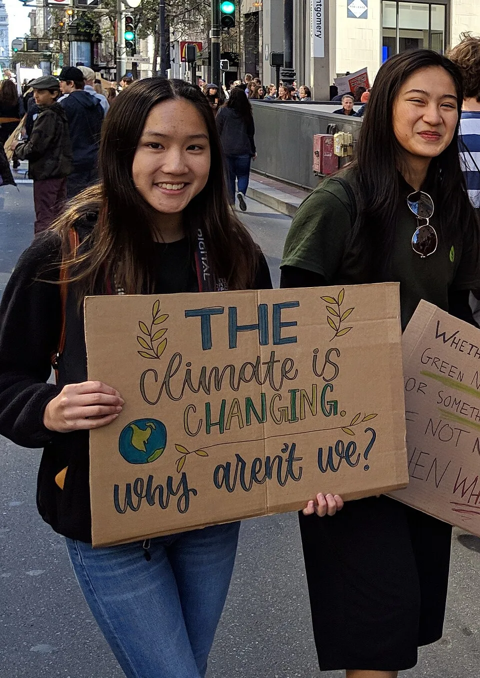 لافتة مظاهرة كُتب عليها «The climate is changing. Why aren't we?»، صُوّرت في San Francisco, الولايات المتحدة.