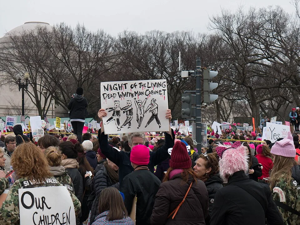 Protest sign reading “Night of the living dead white man cabinet”, photographed in Washington, United States.