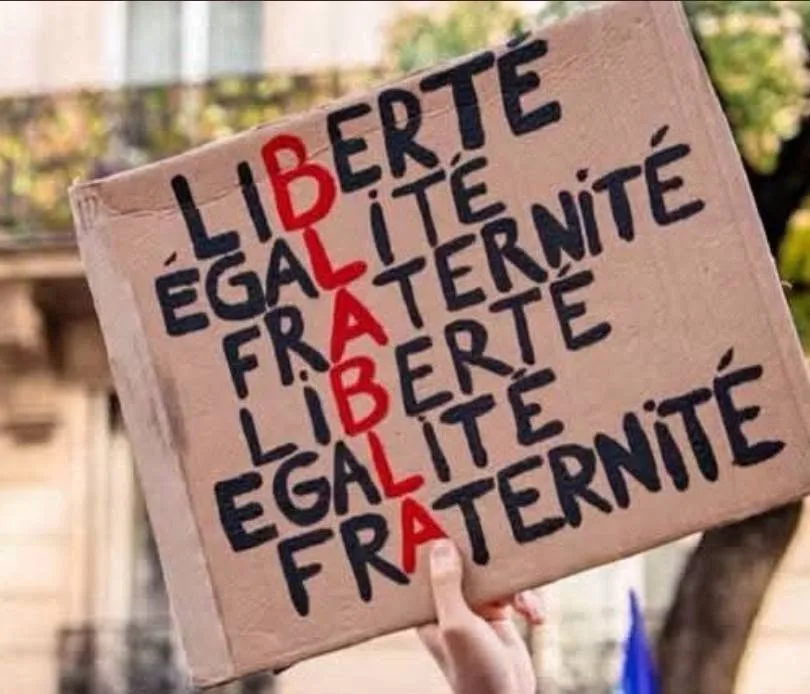 Protest sign reading “Liberté, égalité, fraternité (blabla)” at “Manifestation du 17 octobre 2026 en France” in France.